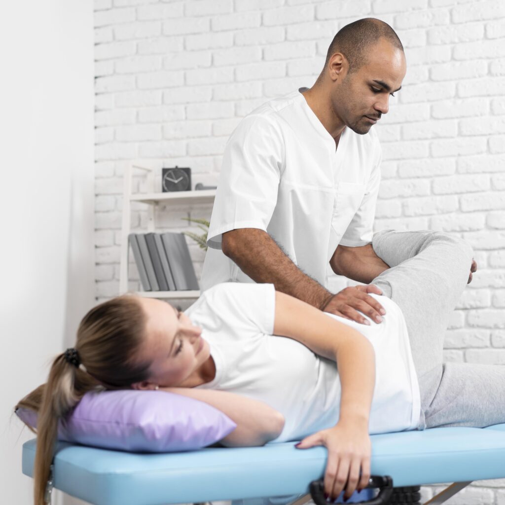 male-physiotherapist-checking-woman-s-hip